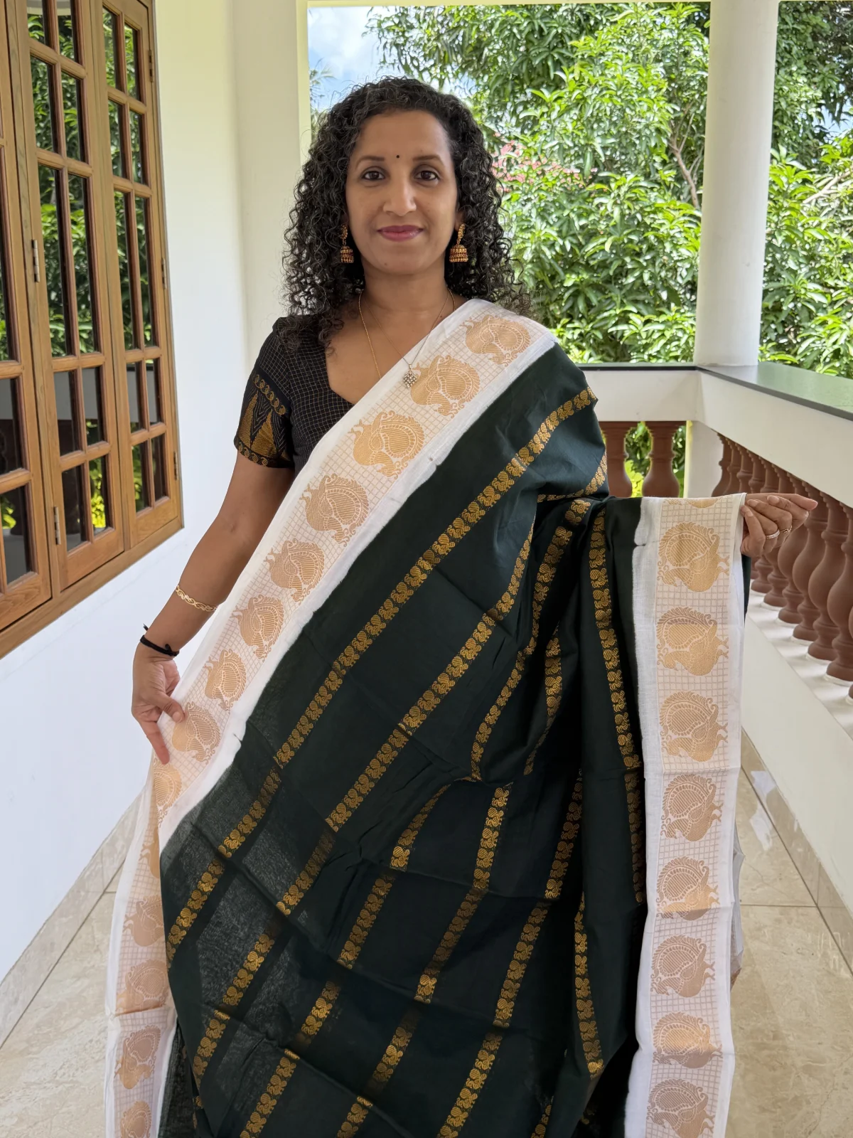Bottle Green and Off white Madurai Sungudi Cotton Saree with Mayil Velthari Design